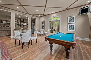 Billards room with a pool table and a tv